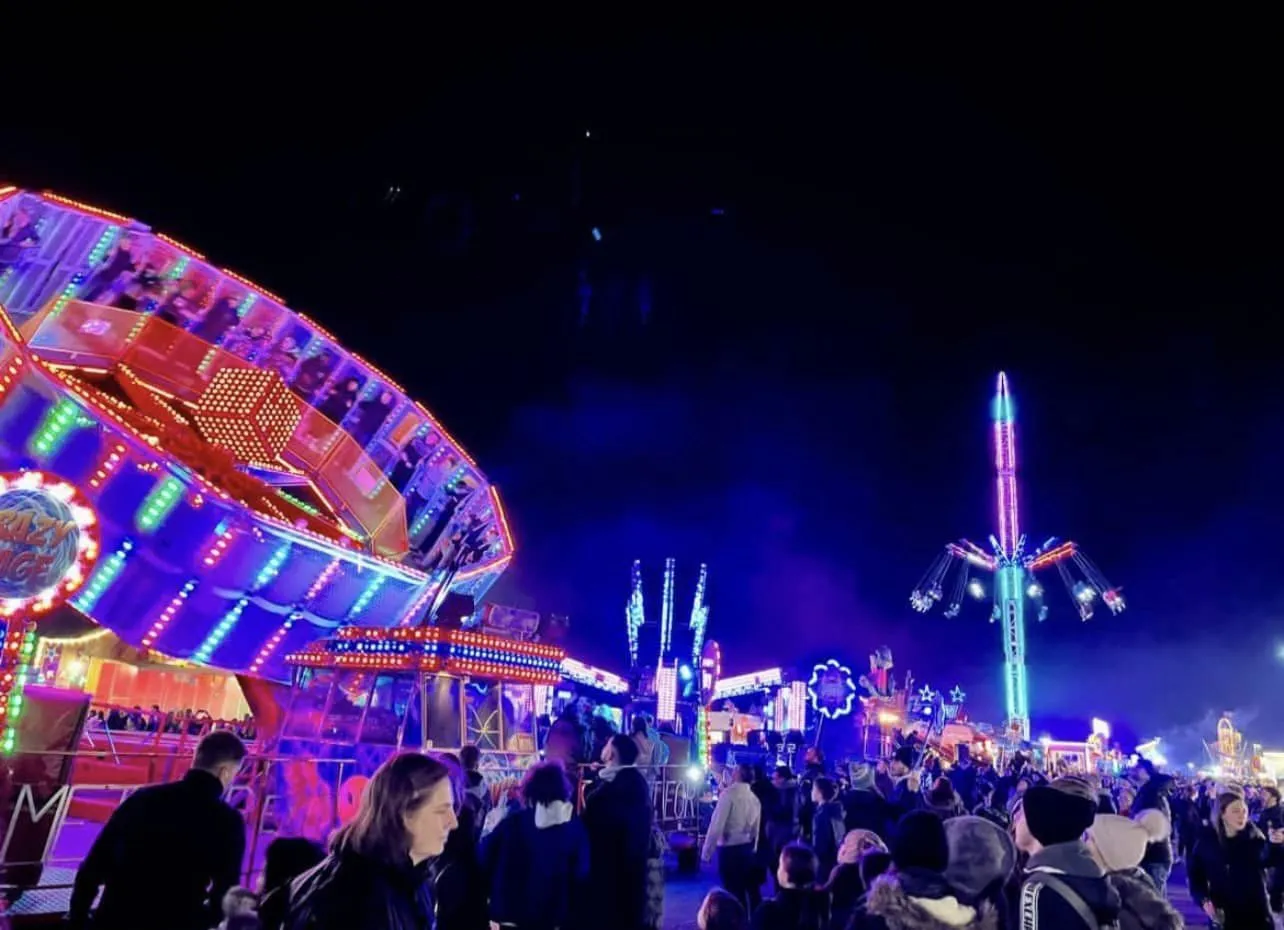 Night-time funfair rides and crowds at Abingdon Funfair & Fireworks